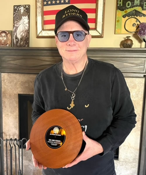 Greg Sowders proudly holds his International Trailblazers award yesterday in the lobby of the Grammy Museum in Los Angeles.